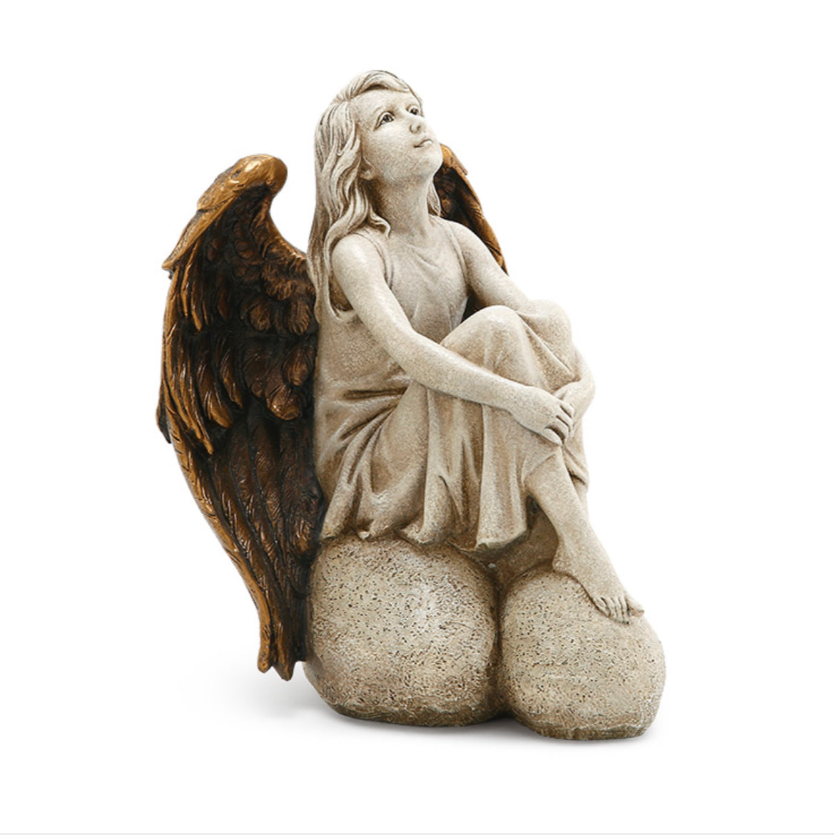 Angel sitting on stone